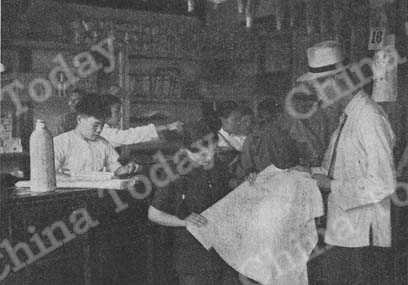 
A peasant woman buys cloth at a well-stocked local co-op.
